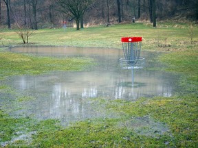 A disc golf basket stands a lonely sentry in V. A. Barrie Park in St. Thomas on Wednesday, April 10, 2013, where heavy rains have created ponding on Spohn's flats along Kettle Creek. The Kettle Creek Conservation Authority has issued a flood watch through Thursday. Eric Bunnell/QMI Agency/Times-Journal