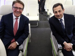 Porter Airlines President and CEO Robert Deluce, left, and Bombardier President Mike Arcamone announce the purchase of 36 new 30 CS100 jets by Porter for $2.29 billion at Billy Bishop Toronto City Airport in Toronto on Wednesday.