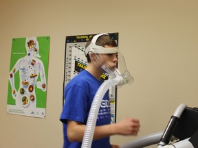 Fourteen-year-old soccer player Keenan Moores demonstrates the VO2 Max machine at the Syncrude Sport and Wellness Centre Tuesday evening. TREVOR HOWLETT/TODAY STAFF