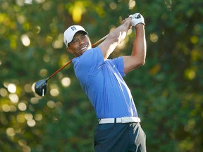 Tiger Woods hits his tee shot on the 11th hole during a practice round in preparation for the 2013 Masters golf tournament at the Augusta National Golf Club in Augusta. Woods, now ranked No. 1 in the world once again, looks to get back on the major’s win roster. (Brian Snyder/Reuters)
