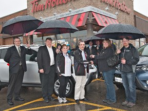 BRIAN THOMPSON, The Expositor

Brantford Toyota sales manager Chris Dam (left) and dealer principal Paul Hogewoning join Gina and Frank Baviera, owners of the Tim Hortons location at 225 Henry St., in presenting the keys to a 2013 Toyota RAV4 to Jennifer Duffield of Brantford, along with her husband Scott (right) on Wednesday.