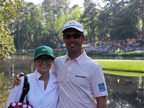 Jackie Viglasky, left, is pictured with Mike Weir at the Augusta National Golf Course for Wednesday's Masters Par 3 competition. The 17-year-old cancer survivor was asked by Weir to serve as his caddy for the event. SUBMITTED PHOTO