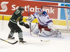 London Knights forward Bo Horvat shoots on Kitchener Rangers goalie John Gibson, scoring the second goal of the game, during game 2 of their OHL Western Conference semi-final matchup at Budweiser Gardens in London. (CRAIG GLOVER The London Free Press / QMI AGENCY file photo)