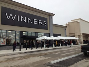 People wait in line for the new Winners store in Owen Sound to open.