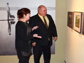 Virginia Eichhorn, director and chief curator of the Tom Thomson Art Gallery, discusses a Tom Thomson painting with Bruce-Grey-Owen Sound MP Larry Miller earlier this year.