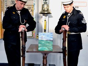 Leading Seaman Hannah Zuidema, left, and Master Seaman Alexandre Fortier stand guard over the cenotaph during a small ceremony held by Royal Canadian Sea Cadet Corps Tiger to mark the 96th anniversary of the Battle of Vimy Ridge. The cenotaph features an original painting by ship’s artist SLt. Peter J. Hutchison called The Fields of Vimy.