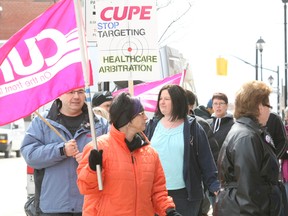 About 30 CUPE members and their supporters rallied outside Nipissing MPP Vic Fedeli's constituency office in North Bay Thursday about plans to make changes to the health care arbitration system.