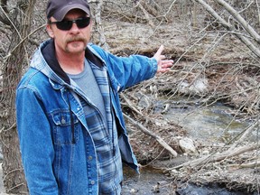 Tillsonburg resident Mark Vanderhaeghe, stands in front a section of Stoney Creek in Tillsonburg. Rainbow Trout have been busy preparing spawning beds over the past few days. Vanderhaeghe is concerned over poachers killing the trout for their eggs and points to their declining numbers as proof.   In the past year alone the numbers of spawning beds and pairs of Rainbow Trout in Stoney Creek have decreased from 25 down to just 10.  

KRISTINE JEAN/TILLSONBURG NEWS/QMI AGENCY