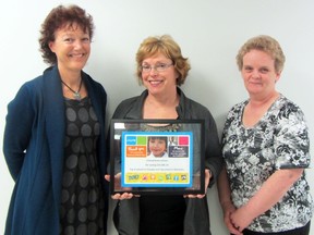 Vice-principal Sheila Henderson, grade three teacher Vicki Hooke, and administrative assistant Edith Bluhm stand with the certificate that Ecole Crescentview School received from UNICEF as the second highest fundraiser in schools across Canada. Hooke noted the honour was really a team effort by the entire school. (ROBIN DUDGEON/THE GRAPHIC/QMI AGENCY)