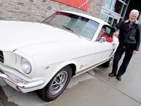 Janet Brooks, housewares manager at Canadian Tire, gets the feel of the 1965 Mustang Fastback with Barry Fraser, for the Rotary Club of Chatham's 13th Annual Mustang Car Raffle. The car will be on display, with tickets available, in front of the Canadian Tire on Grand Ave. West until Sunday. (DIANA MARTIN, Chatham Daily News)