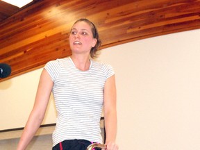 Instructor JJ Morgan demonstrates a joint-friendly yoga exercise during Grande Prairie Parkinson Alberta Education Day at the Golden Age Centre (10222-101 Avenue) on Tuesday. (Elizabeth McSheffrey/Daily Herald-Tribune)