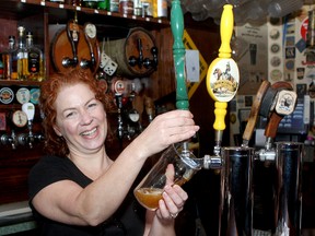 Krista Garrett pours a beer at the Kingston Brewing Company.
Ian MacAlpine The Whig-Standard