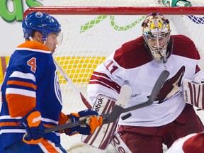 Edmonton Oilers’ Taylor Hall tries to deflect a shot past Phoenix Coyotes goalie Mike Smith during first-period NHL action at Rexall Place in Edmonton on Wednesday night. The Coyotes won 3-1. (Amber Bracken/QMI Agency)