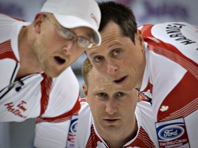 Canada skip Brad Jacobs along with teammates Ryan Harnden (left) and E.J. Harnden – seen here in action at the World Curling Championships – are on the verge of a berth to the Roar of the Rings. (Andy Clark/Reuters)