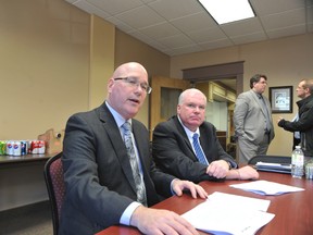 RONALD ZAJAC The Recorder and Times
Leeds-Grenville MPP Steve Clark, left, discusses provincial arbitration with Ontario Progressive Conservative House Leader Jim Wilson after a meeting with local mayors at Prescott's town hall on Thursday, April 4.