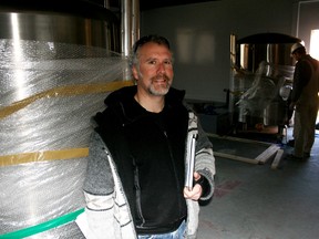 Lake of the Woods Brewing Company’s Taras Manzie oversees delivery of stainless steel tanks, Thursday. The tanks will be used for aging the ale and beer that will be brewed on site at Kenora’s heritage firehall on Second Street South. The brew pub, restaurant and retail sales store is scheduled for an end of May opening.
REG CLAYTON Miner and News