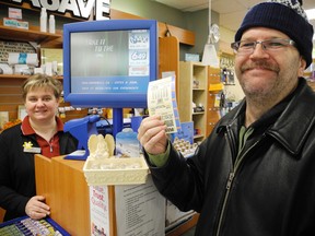 Jennifer Baker, cash supervisor at the Delhi Pharmasave, sold Chris Wolfer a lottery ticket on Friday that he hopes will lead to a $55 million Lotto 6/49 payout. The biggest jackpot in Canadian history  will be drawn on Saturday. (SARAH DOKTOR Simcoe Reformer)