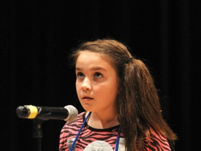 Jenna Duarte turns to the heavens for a little help spelling a word. Duarte represented her school, PE McGibbon, with a first place trophy in the Grade 3 and 4 competition. (BLAIR TATE, For The Observer)