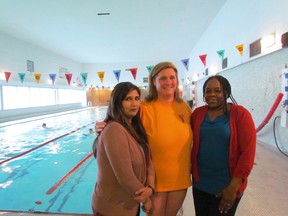 Saira Anjum (left) and Jane Omollo (right), of the Sault Community Career Centre, join heads with Kim Caruso, Sault Ste. Marie YMCA CEO, to put things in place for an upcoming female-only swim at the Y's pool.