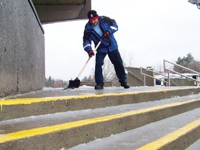 Civic complex worker Marc Pitre clears slush off the front steps prior to the start of this weekend’s Cornwall Chamber of Commerce Spring Home & Leisure show on Friday. The city experienced a combination of freezing rain, pellets and wet snow making for slushy conditions on streets and sidewalks. Despite this, accidents were almost non-existent. There were also no reports of major incidents in the counties. School buses were, however, cancelled. A small power outage occurred near Martintown during the afternoon.
Staff photo/GREG PEERENBOOM