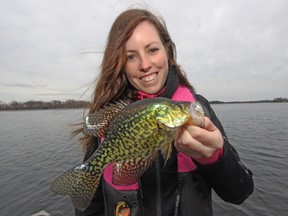 Ashley Rae holds a black crappie she caught during her first boating trip of the year. (Jeff Chisholm)