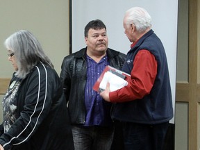 The Grand Chief of Treaty 3, Warren White (middle), chats with other participants after the consultation meeting on the proposed First Nations Education Act concluded in Kenora on Friday, April 12.