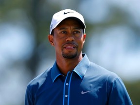 Whether Tiger Woods should have bowed out of the Masters in the wake of his dropped-ball controversy is a hot topic. (REUTERS)