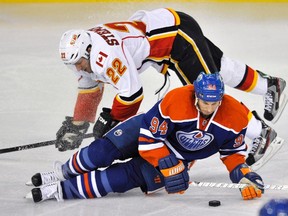 Calgary's Lee Stempniak and Edmonton's Ryan Smyth collide during Saturday night's NHL game (Reuters).