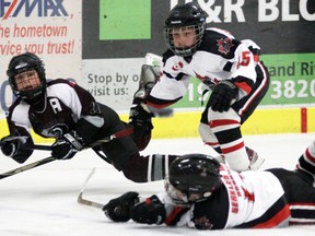 Tillsonburg Ward’s Automotive Novice Nolan McCrossin (left) has his eye focussed firmly on the prize Sunday afternoon during the SCHMA A Division championship game at the Brant Sports Complex near Paris, despite the best efforts of a pair of Ingersoll defenders including Ethan MacPherson (rear). McCrossin didn’t score on this shot, but did find the back of the net during a four-goal second-period run that helped lift Tillsonburg to a 7-3 victory. For further details on this game, and a dramatic Tillsonburg Dyco Tool Oldtimer Peewee overtime victory over Glanbrook, see today’s sports section. Jeff Tribe/Tillsonburg News