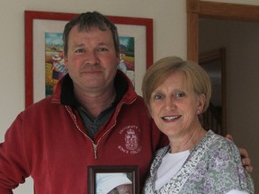 Susan and Haynes Hubbard hold a picture of Madeleine McCann, who made international headlines when she went missing from a small village in Portugal in 2007. 
Danielle VandenBrink/The Whig-Standard