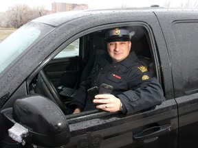 Frontenac Ontario Provincial Police Const. Marc Gallant has seen plenty of instances of people still using handheld devices, such as cellphones, while driving.
Ian MacAlpine The Whig-Standard