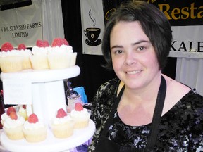 SARAH DOKTOR Simcoe Reformer 
Kaley Horton, owner of Kaley's Restaurant and Kaley's Kakes shows off some of her sweet treats at Eat & Drink Norfolk at the Aud on Saturday.