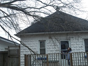 A tree outside Lauri Martz's Bay Street home fell down under the weight of the ice and the force of the high winds during a freezing rain storm Thursday night. (TARA BOWIE, Sentinel-Review)