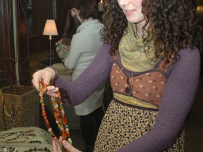 Rebecca Barnes holds a necklace that was donated to the Gems and Java event held at the Innerkip Presbyterian Church Saturday, April 13, 2013. The event raised more than $16,400 for charity Mothers with a Heart for Ethiopia.  (TARA BOWIE, Sentinel-Review)