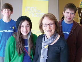 Governor General award winner Monique Yelle, bottom right, was joined by Holy Trinity Secondary School student volunteers, from left, John Paul St. Louis, Kylee Leclair and Justin Levac during the 75th anniversary celebration of the S,D & G and Prescott-Russell Unit of the Canadian Cancer Society at the Benson Centre on Saturday.
Staff photo/GREG PEERENBOOM