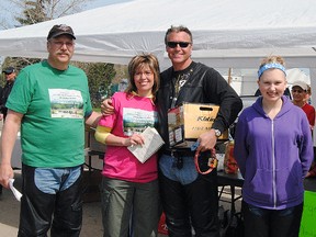 From left to right: Terry Wise; Joanne Belke; Andy Bates and Rachel Wise. Andy Bates accepts the award for the person who raised the largest donation for The Ride For Mom. Bates collected $1790. 
Barry Kerton | Whitecourt Star