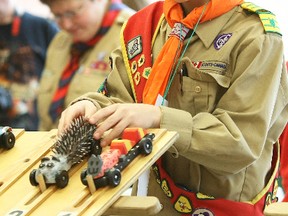 Jared Kelso, of 1st Callander Scouts places his entry into the starting block for the annual Kub Kar rally held at West Ferris Secondary School, Saturday. Kelso's 'porcupine' car won first place for original design and was the racers choice winner, as well as being fast enough to win several heats.