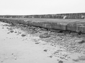 Pictured: wood is exposed underneath the break wall at the Port Elgin Beach with lowered lake level.