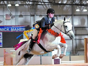 Sherwood Park’s Lorraine Prowse and her purebred Arabian gelding Sur Teddy’s Magna celebrate with a victory jump after winning the U.S. Sport Horse National Championship in the Arabian Working Hunter AAOTR division in Nampa, Idaho.Photo supplied