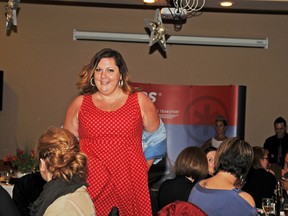 Marla Pellerin struts her stuff in a Deluxe outfit during the Celebrate Under the STARS fundraiser on Friday. (Elizabeth McSheffrey/DHT staff)