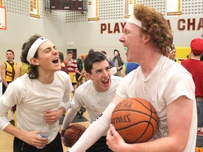 Rider Luke Webb gets cheered on by his fellow students during the first leg of the Inside Ride in their gym at Regiopolis-Notre Dame Catholic High School. The event is an annual fundraiser to help children with cancer.
Michael Lea The Whig-Standard