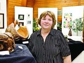 Kay McCormack stands with her work at last year’s Art Society of Strathcona County’s annual fall exhibition show and sale.