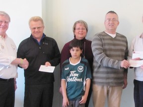 Contributed Photo
The Simcoe Lions Club has donated $15,000 towards the construction of a pavilioin at the Norfolk Youth Soccer Park. Pictured are: Lions member Wray Rodgers; Nick Childs, vice-president of Simcoe and District Youth Soccer Club; Lisa Chanyi-Baruth, secretary of SDYSL; Ben Baruth, Simcoe Youth Soccer representative. Bernie Solymar, past president of SDYSC and fundraising co-ordinator for this Building Project; Lions member Doug Love and  Lions member Dave Stelpstra.