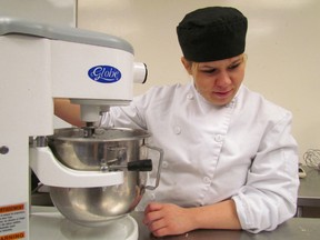 Lambton College student Melissa Heller whips up a cake at the culinary arts kitchen. She says the college's Community Integration through Co-operative Education (CICE) program really caters to students. SUBMITTED PHOTO