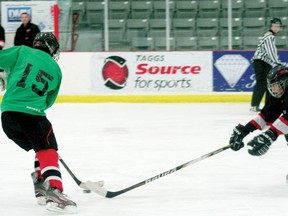 A member of the Moves Like Jagr team tries to deak around the defense of the Penalty Box Heros in one of the first few games of the Hockey for Health three vs three tournament. The tournament is a fundaiser for the Lake of the Woods District Hospital and started on Monday, April 15.

GRACE PROTOPAPAS/Daily Miner and News