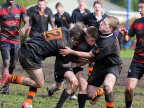 Brannon Edgar and Trevor Pelland team up for a tackle in their game against the Cowichan Thunderbirds. (Photo courtesy Brenda Pelland)