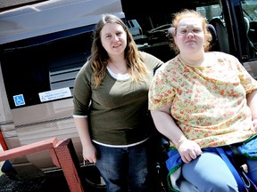Care worker Terri-Lynn Preudhomme, left, demonstrates what's needed to get Jessica Elsley into a modified wheelchair accessible van. Elsley has entered an online contest to win a fully loaded van to replace her 13 year-old vehicle so she can maintain her independence.(DIANA MARTIN, Chatham Daily News)