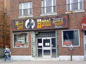 A pedestrian walks by the Maple Leaf Hotel in 2004. Memorabilia from the tavern, including the iconic hotel’s sign, will be added to the collection of the Timmins Museum: National Exhibition Centre.