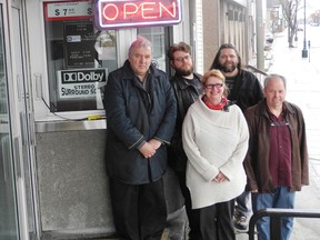 New co-owners Larry Sylvain and his wife Nancy Bonner stand in front of the Port Theatre on Tuesday afternoon with their partner Glenn  McGillivary and Port promoters, Nick Sylvain and Jeff Brunet.
Staff photo/ERIKA GLASBERG