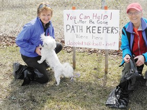 Daune MacDonald and Mary Jolly put a sign in the grass at the intersection of Second Street East and Nick Kaneb Drive to raise awareness about their initiative “Path Keepers.” The duo, along with other members, do their part for the environment and clean up any garbage laying along the city’s busy paths.
Staff photo/ERIKA GLASBERG